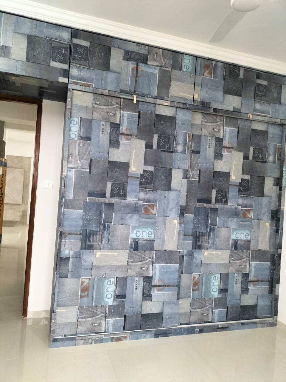 Blue patterned laminate wall with matte finish and abstract design featuring mixed rectangular shapes and numbers.