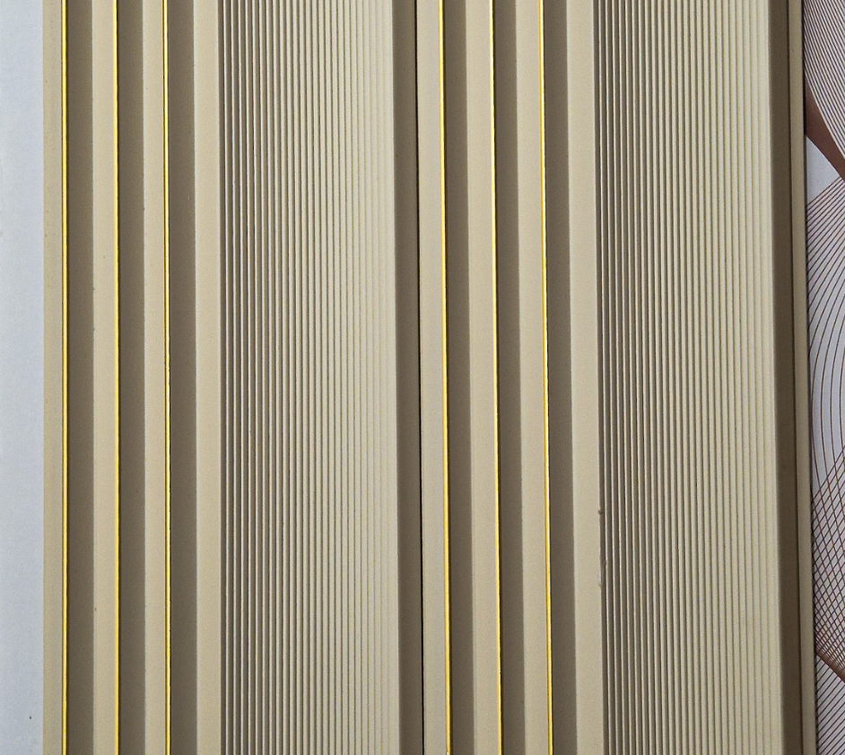 Metaluxe Ivory Fluted Panel louver panel, a soft cream-ivory fluted panel with gold pinstripe trim