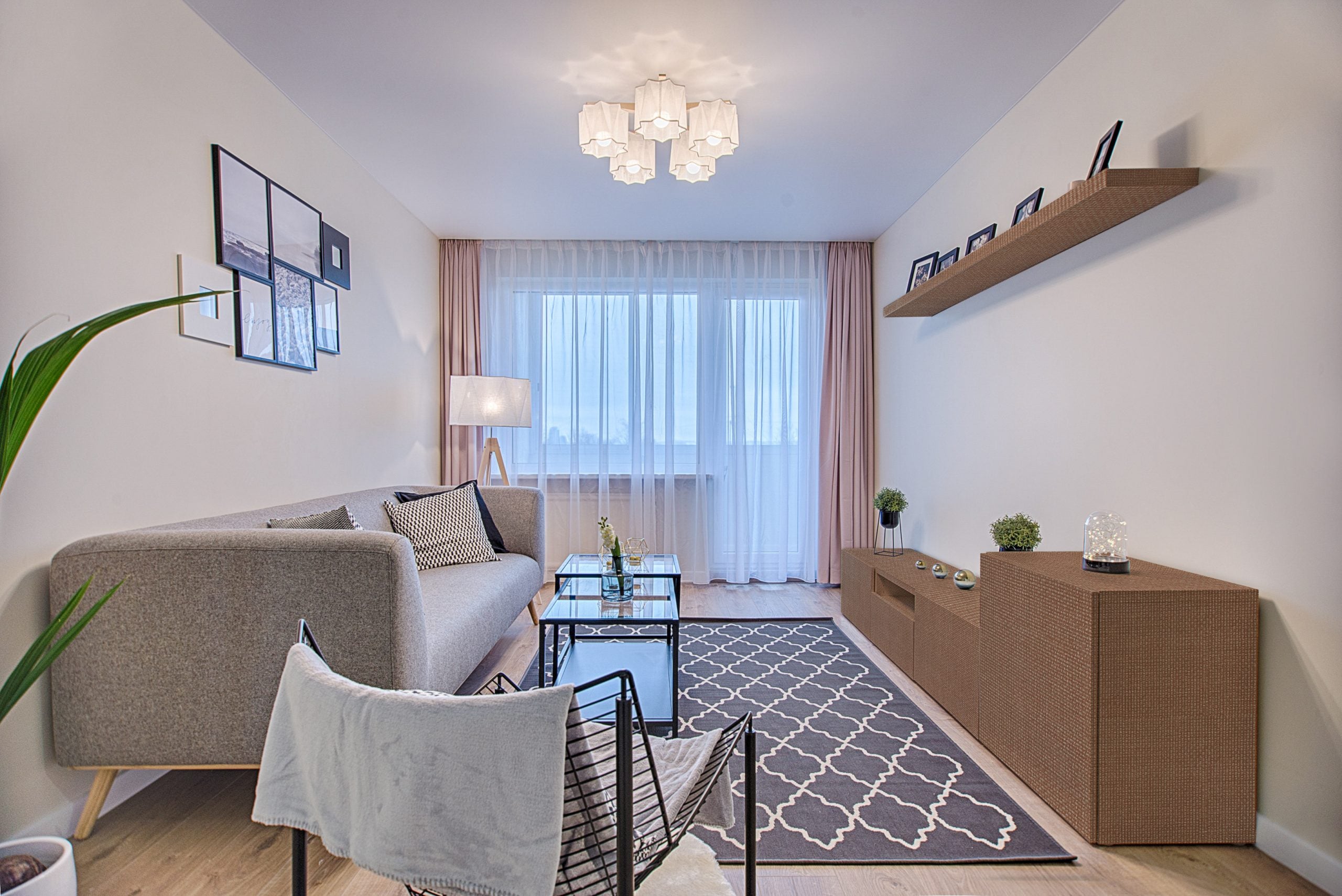 Brown patterned laminate used on shelves and cabinet in a modern living room with neutral decor and minimalist furniture.
