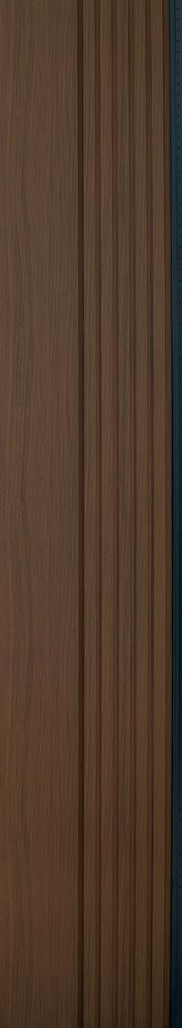 Brown fluted wall panel with textured finish and vertical grooves, showing wood grain pattern and slight sheen on surface.