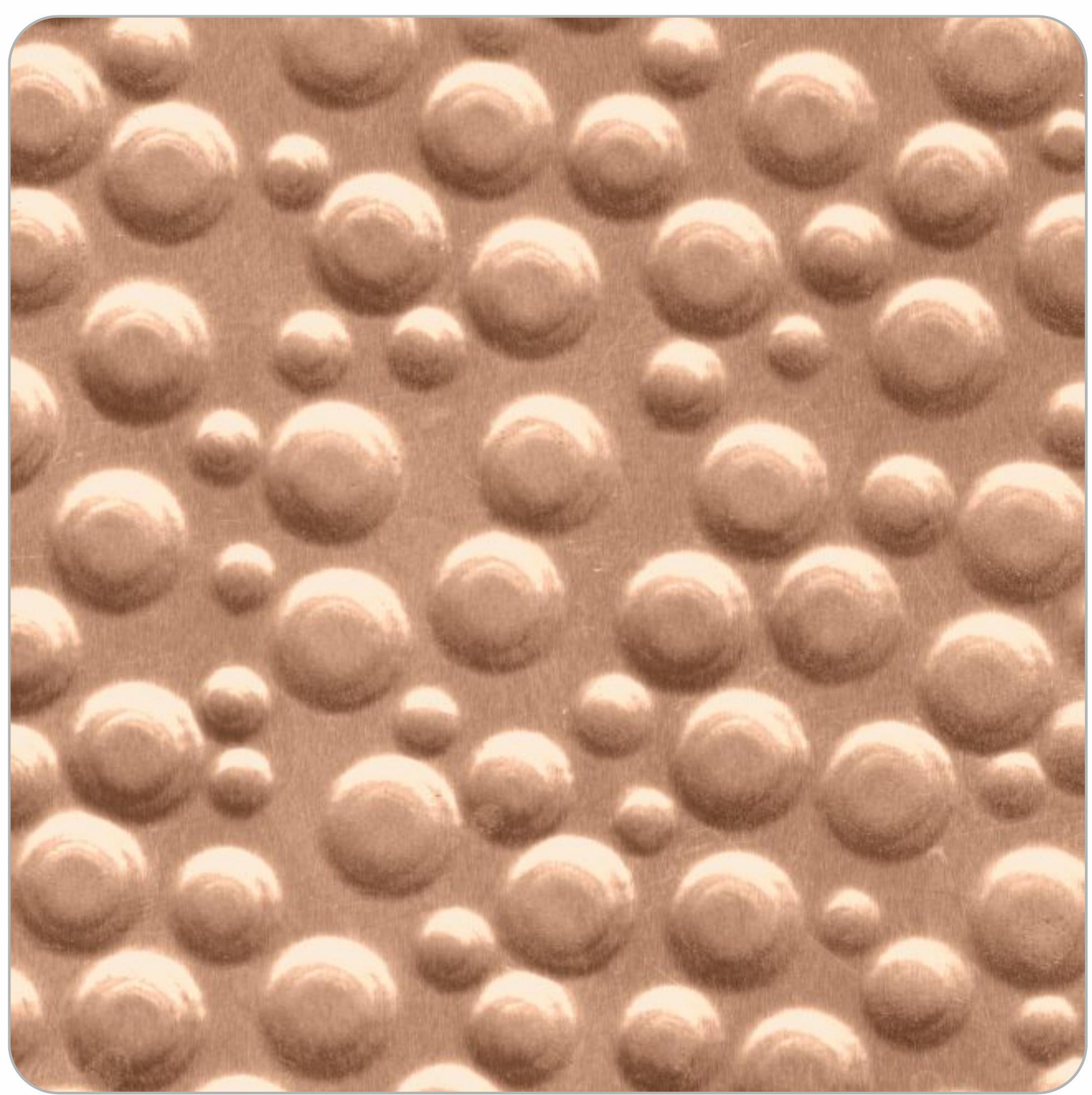 Beige laminate sheet with textured, embossed circular pattern and smooth sheen.