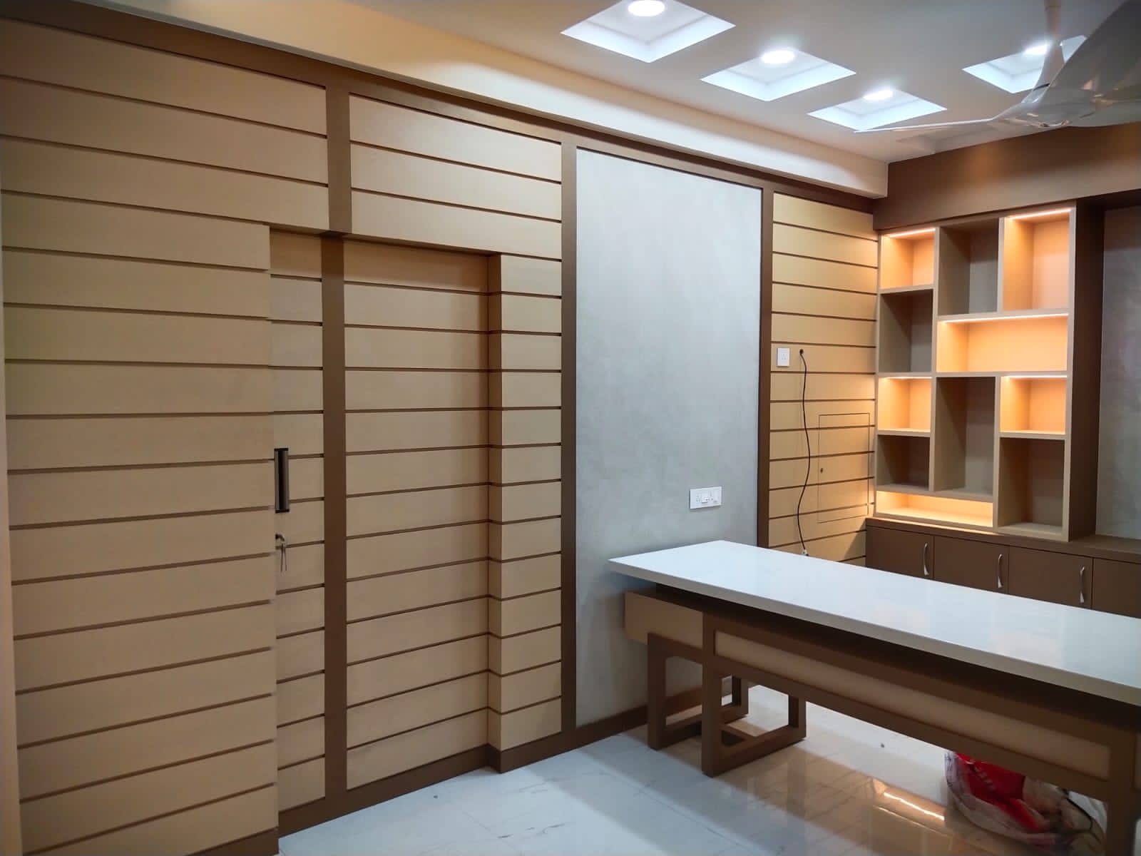 Beige leather laminate wall panels with matte finish and horizontal slats in a modern interior design setting