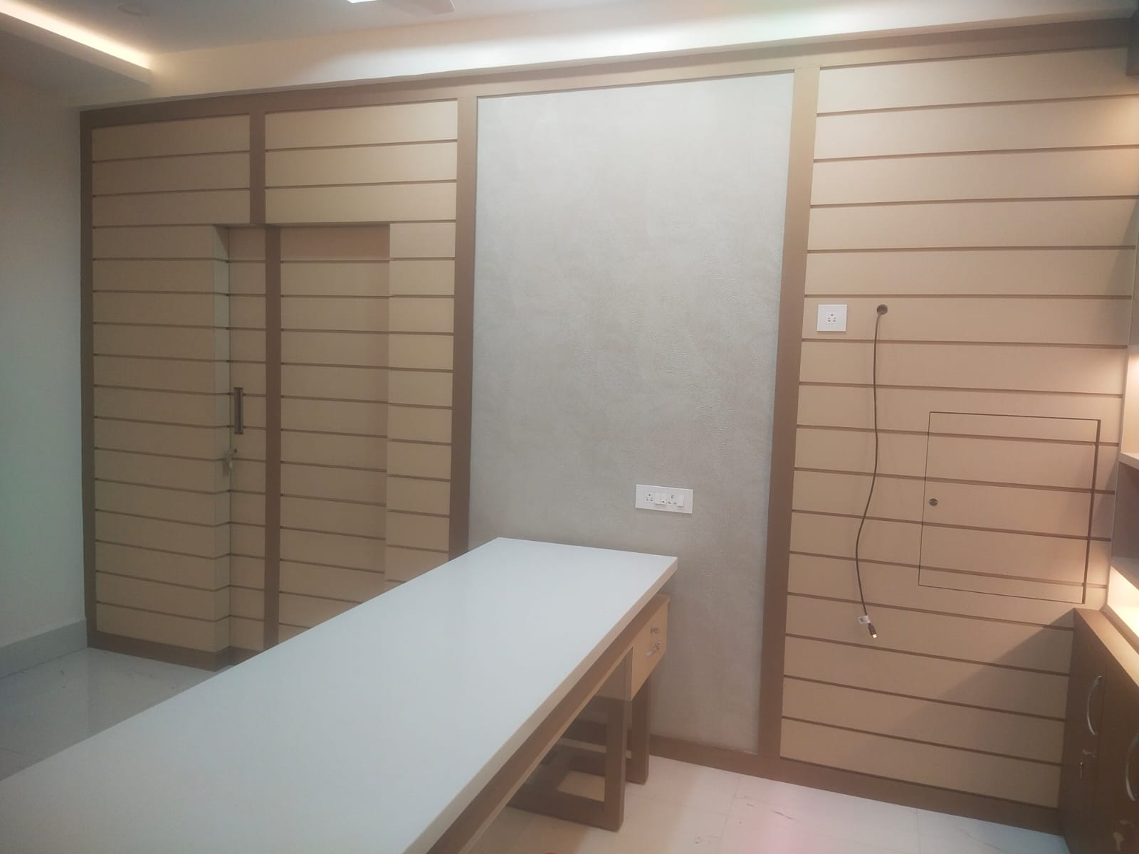 Beige leather laminate wall with matte finish and horizontal pattern used in modern interior design with furniture and