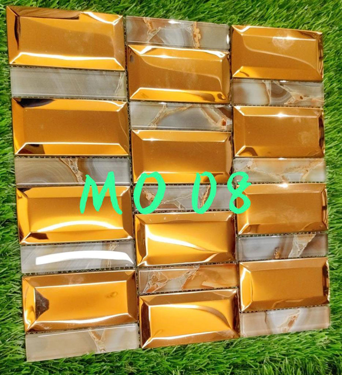 Gold marble louver panels with textured finish and marble pattern, arranged in grid on green grass background, showing MO 08
