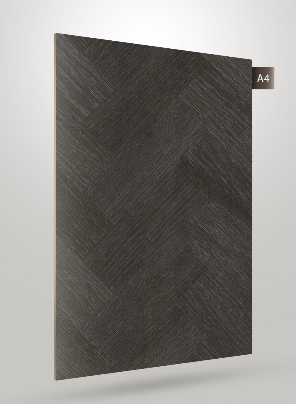 Dark grey matte laminate with diagonal herringbone pattern and textured finish, showcasing subtle grain details and A4 label.