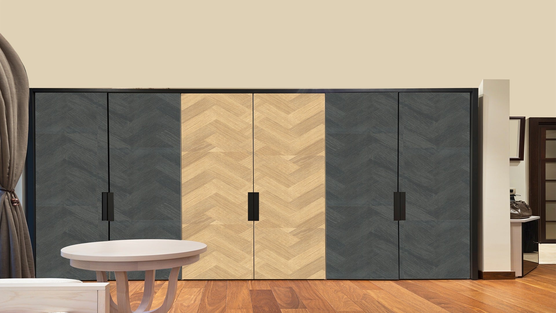 Multi-coloured patterned laminate wardrobe with chevron design and matte finish in dark grey and light wood tones.