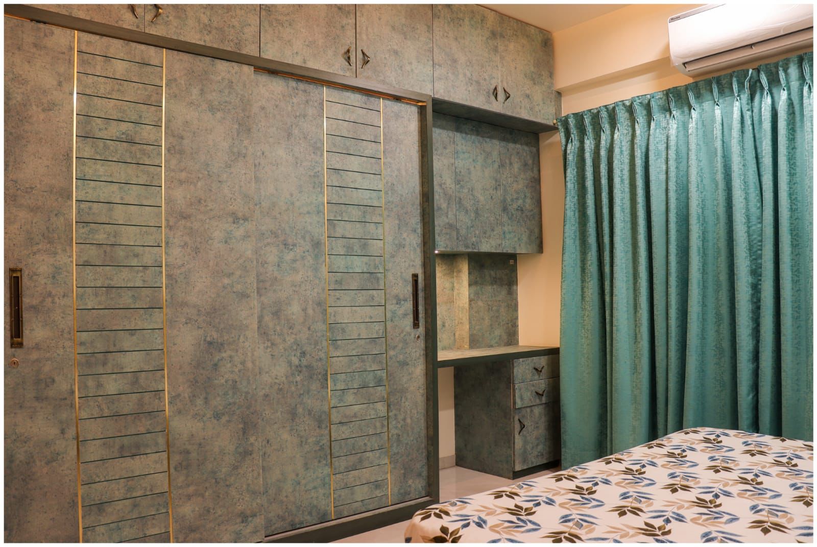 Grey marble laminate used on bedroom closet and shelving with matte finish and subtle veining pattern on the surface.