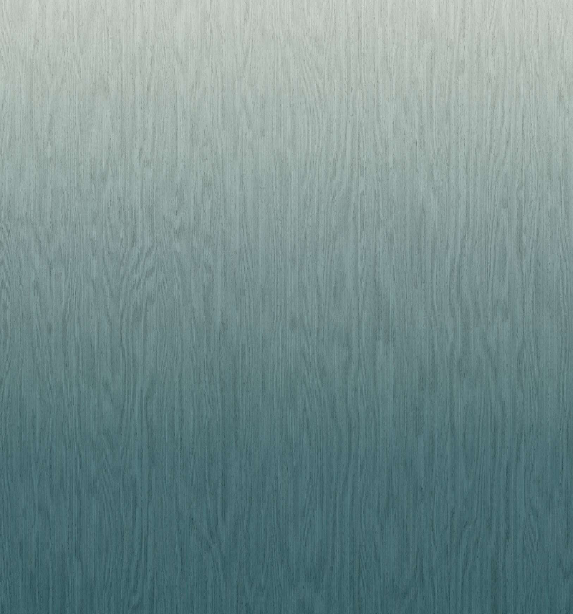 Gradient laminate fading from light silver to deep teal blue with a fine brushed texture, matte finish.
