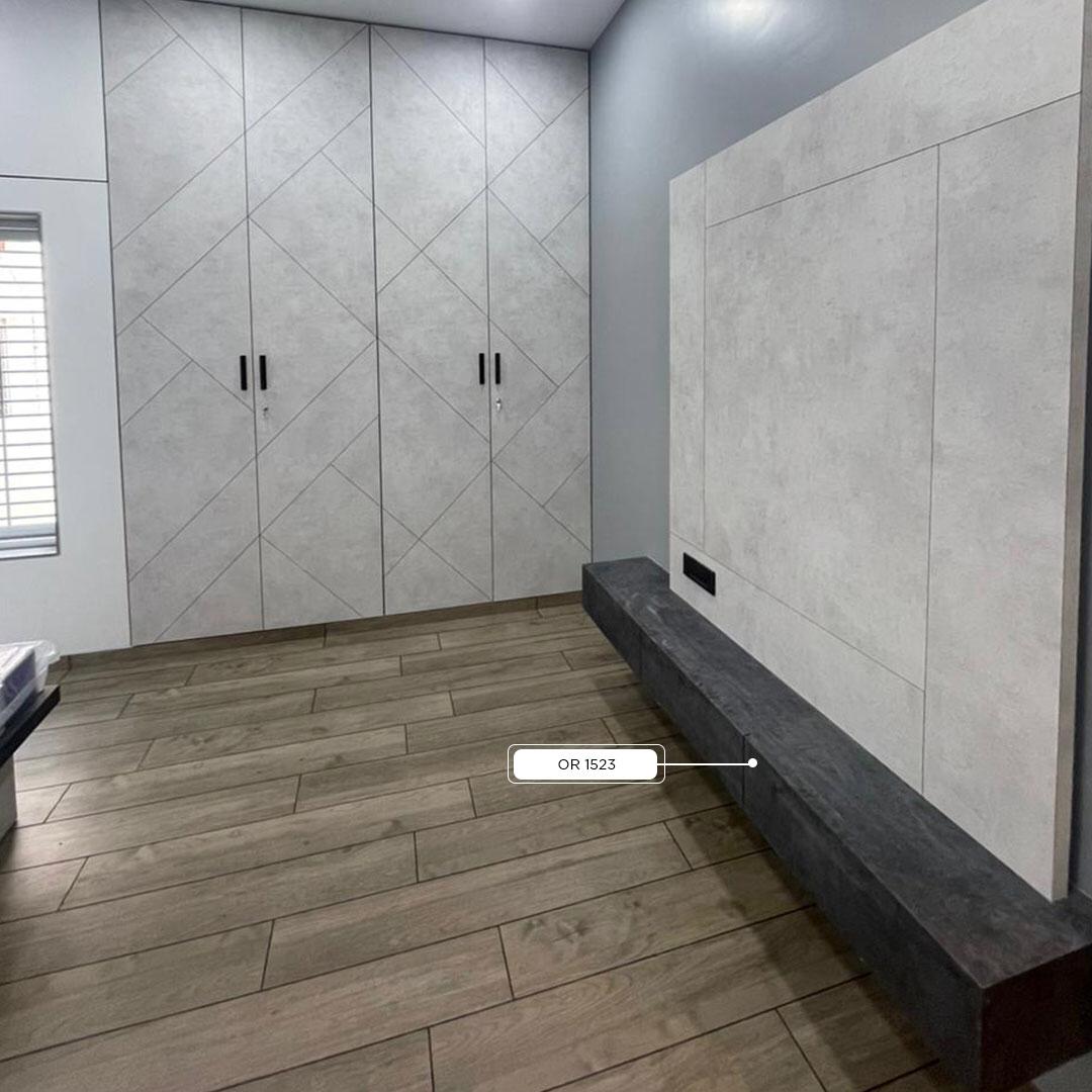 Grey marble laminate wall with geometric pattern and matte finish on cupboards and bench in modern interior space