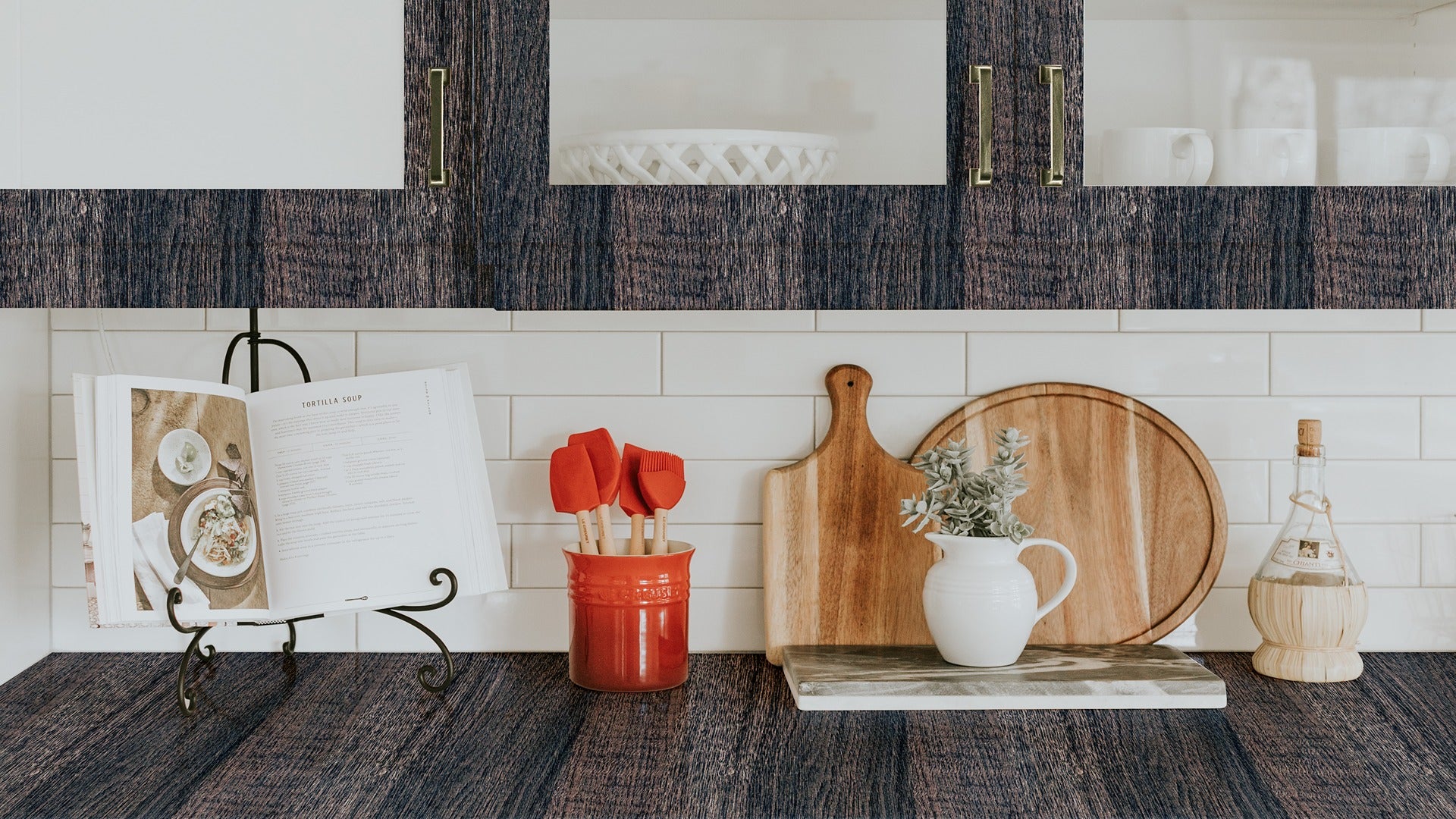 Multicoloured wood grain laminate backsplash with glossy finish and textured pattern in a modern kitchen setting with white