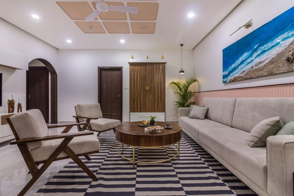 Beige wood laminate used on cabinet and doors in modern living room with striped rug and minimalist furniture.