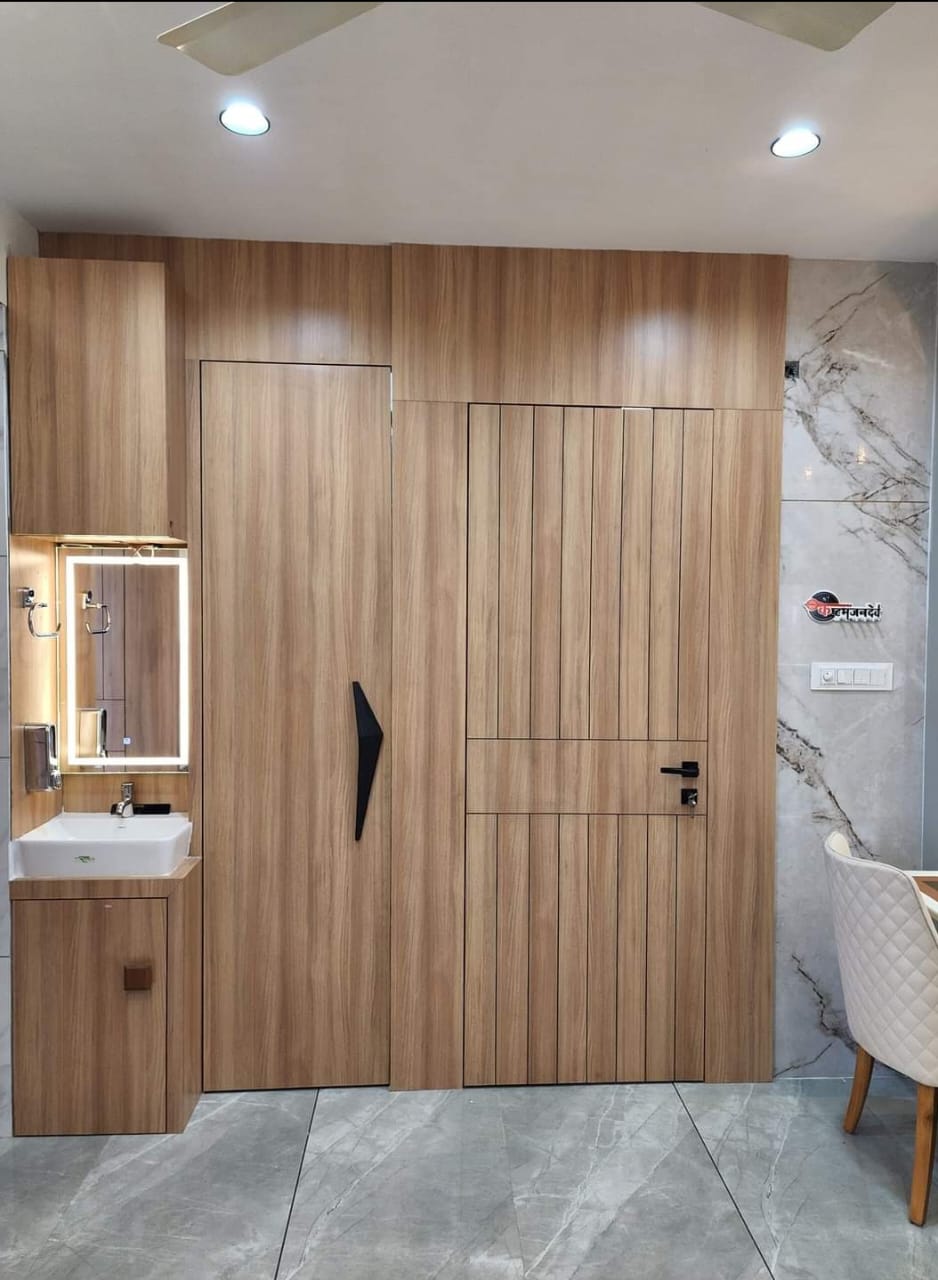 Beige wood grain laminate used on bathroom cabinet and door with matte finish and vertical wood pattern in modern interior