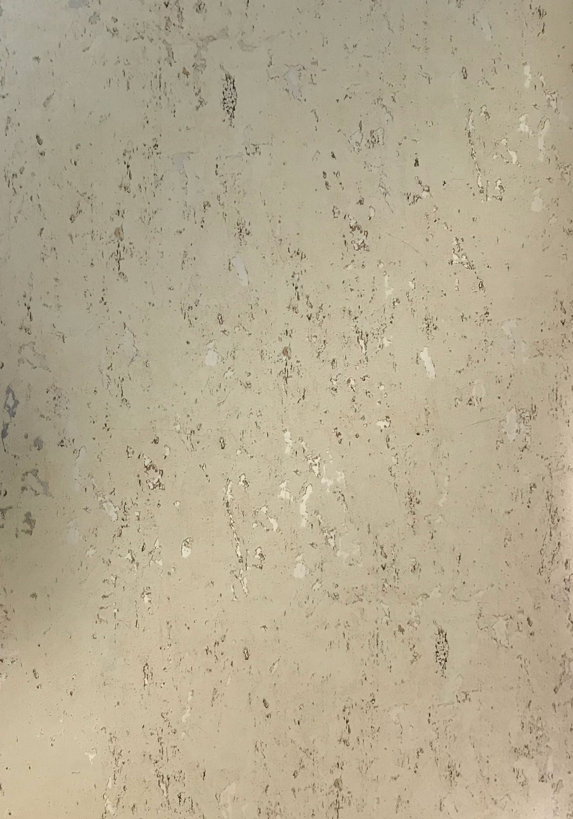 Beige marble laminate wall panel with textured finish and speckled pattern.