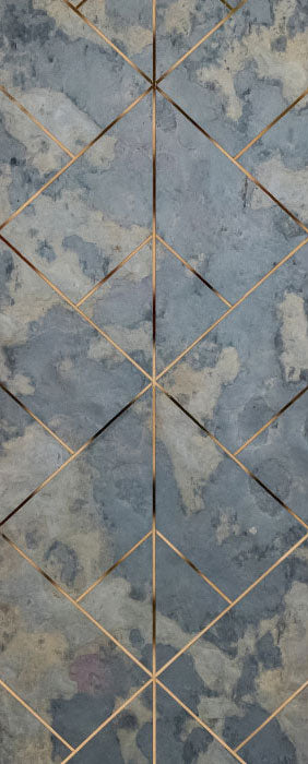 Grey marble wall panel with textured finish and gold diamond pattern accents on a geometric grid design surface