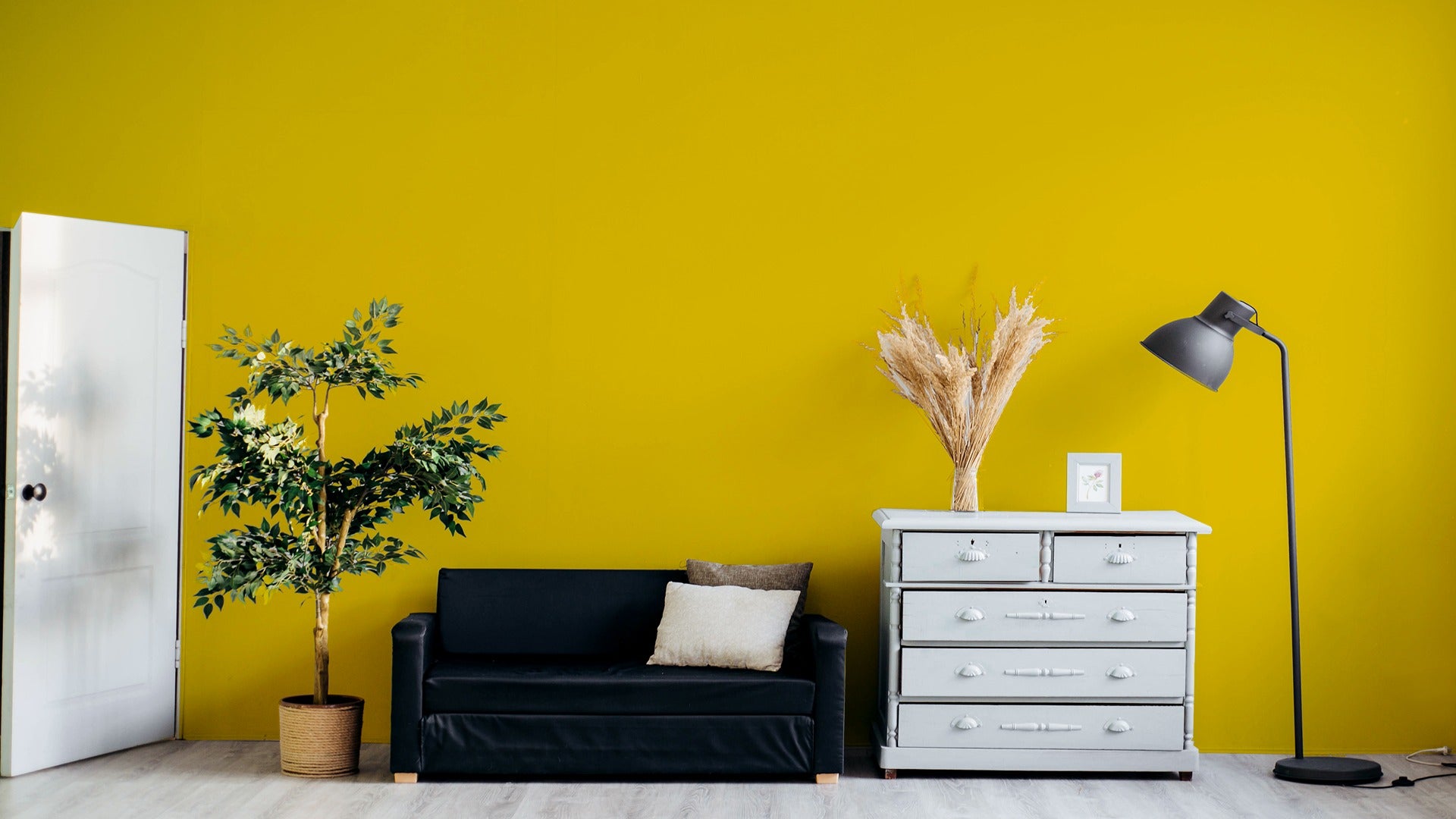 White laminate door with matte finish in a room setting with yellow wall and furniture.