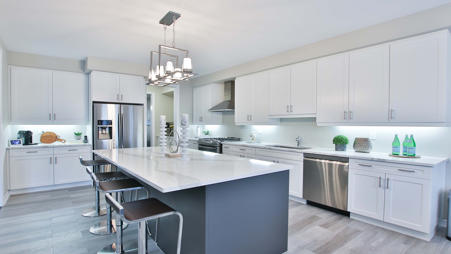White decorative laminate kitchen cabinets and countertops with matte finish and smooth texture in modern kitchen setting