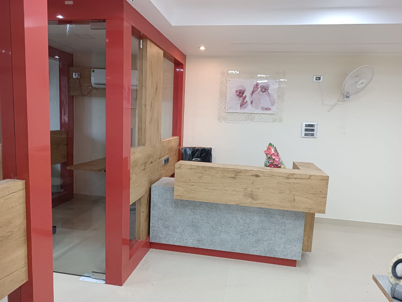 Multicolour marble laminate reception desk with matte finish and textured surface in modern office interior