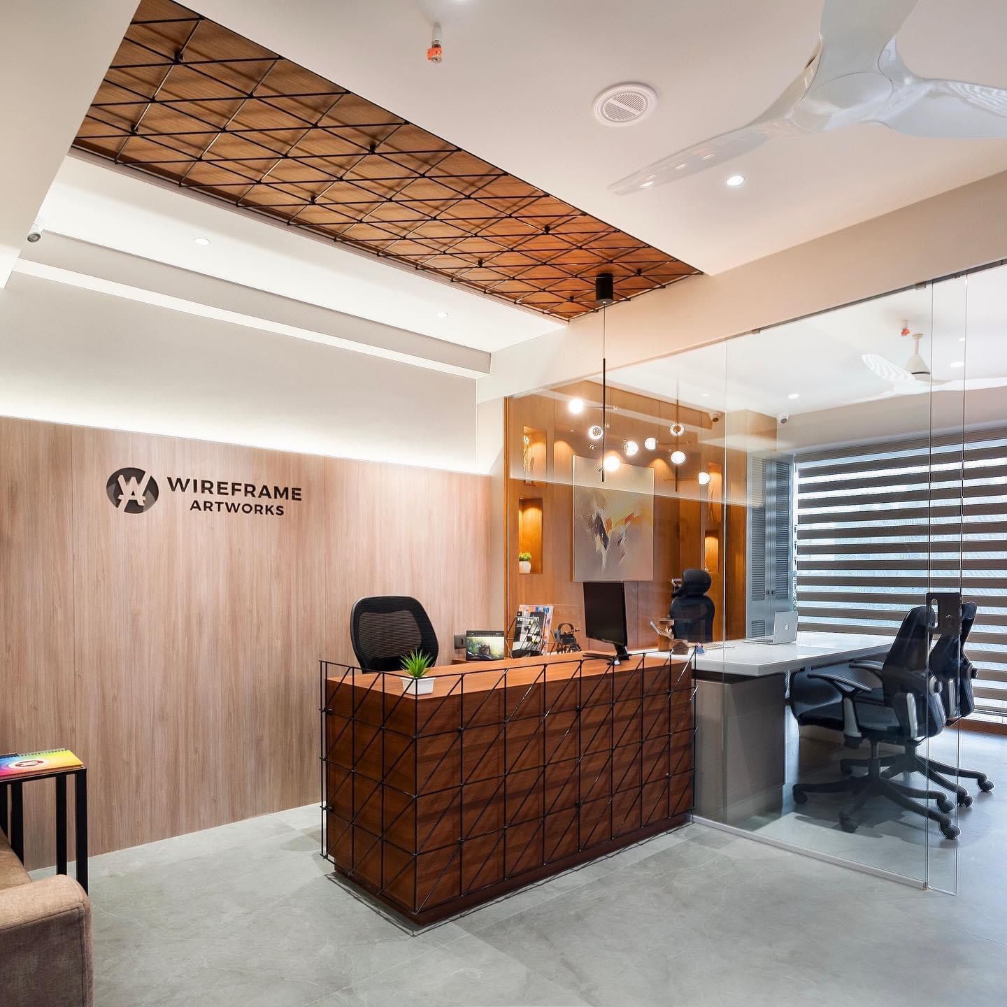 Wood laminate reception desk and ceiling with matte finish and wood grain texture in modern office interior design setting