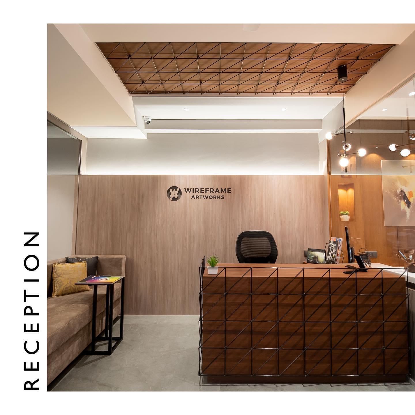 Wood laminate reception area with wooden wall panel and ceiling featuring grid pattern and matte finish wood grain texture