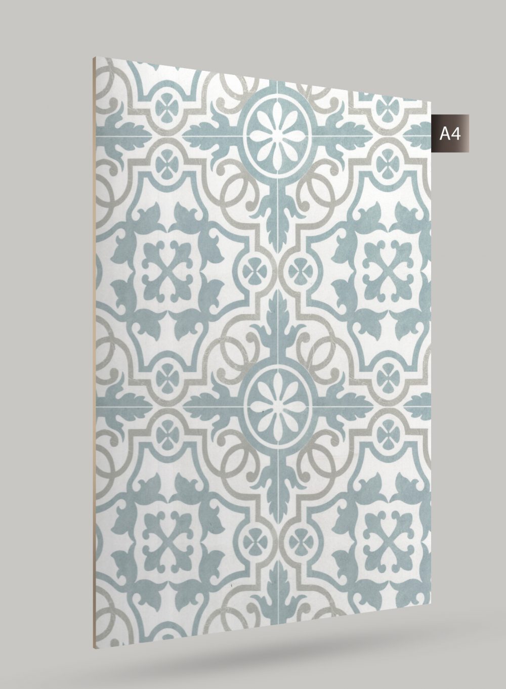 Blue patterned laminate with floral design and matte finish, showing texture and repeating pattern on a white background.