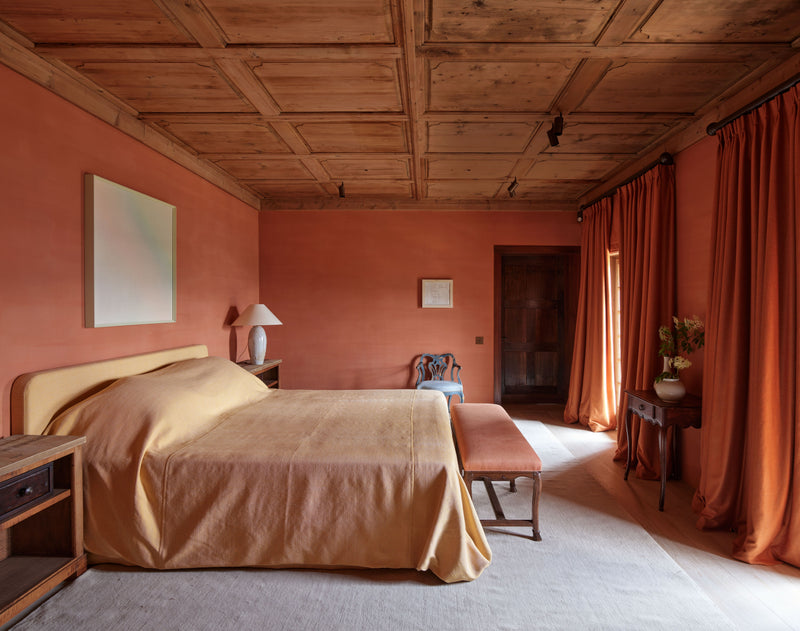 Coffered wood wall panel ceiling in a bedroom