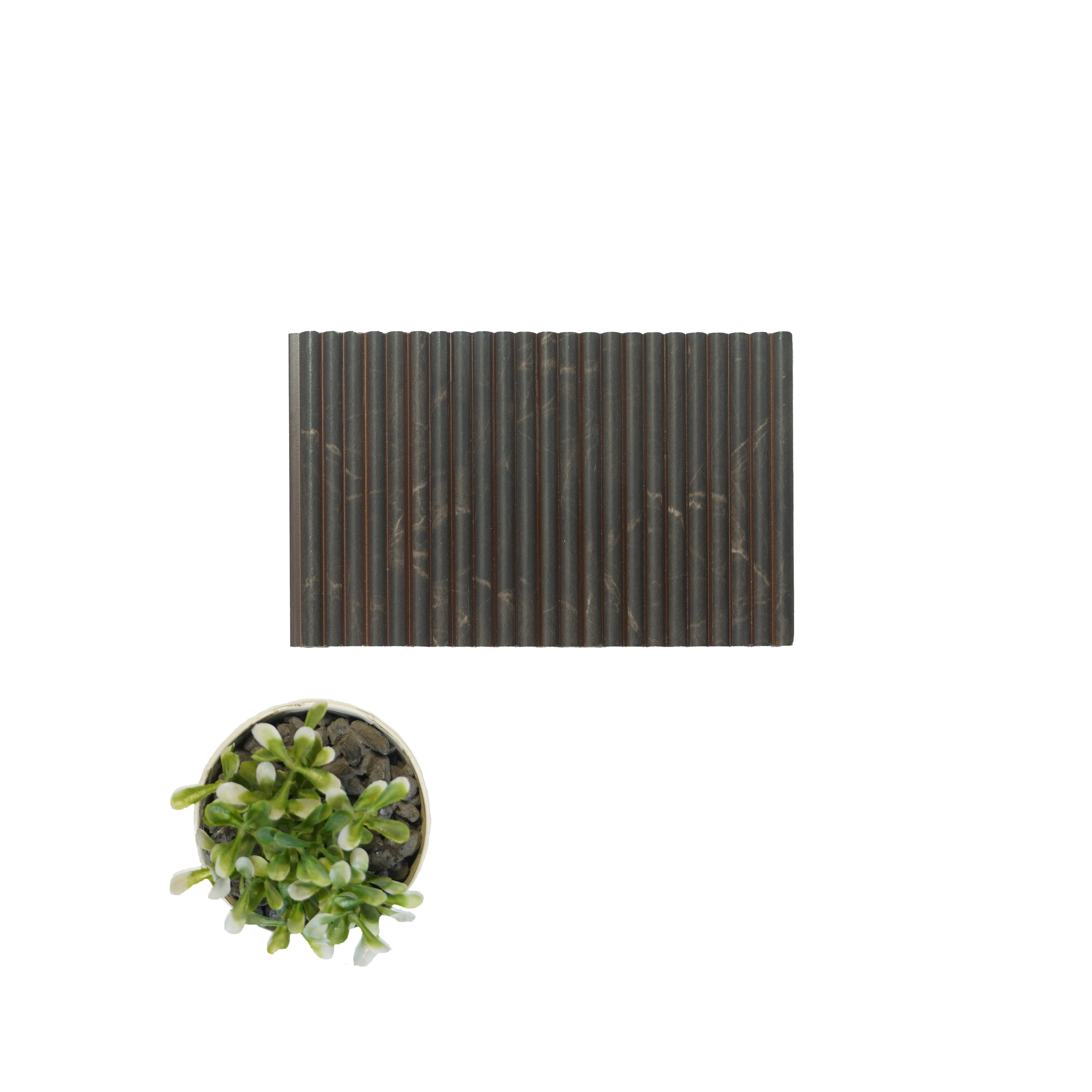 Brown marble louver with veining pattern and smooth finish, alongside a small potted plant with green leaves