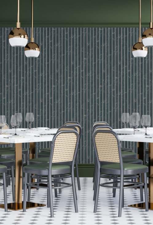 Grey marble louver wall with veining pattern in a modern dining setting with white tables and green chairs