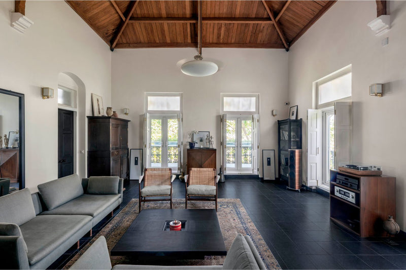 Wood Veneer Ceiling and Black Laminate Coffee Table in a Living Room